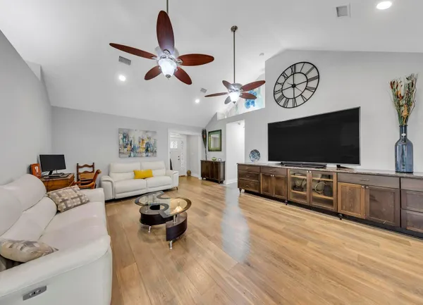 a living room with furniture and a flat screen tv