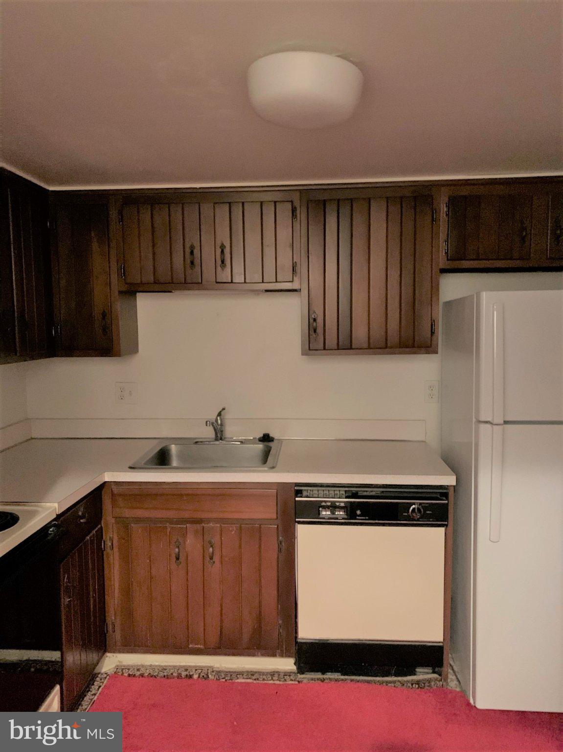 300 Winding Way, Unit 1 Downingtown, PA 19335 - Photo 10 of 13 Cozy kitchen with classic wood accents.