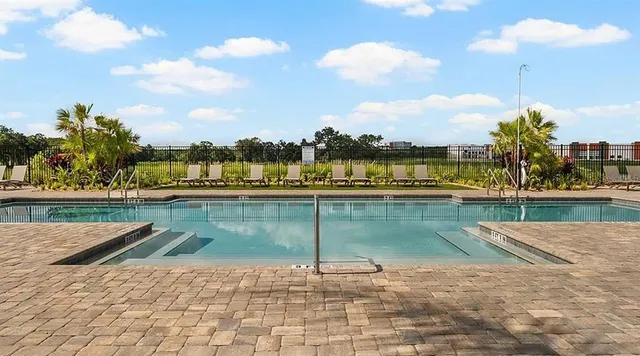 an aerial view of a house with swimming pool