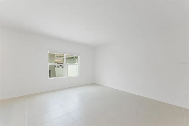 a kitchen with stainless steel appliances a sink a stove a refrigerator and cabinets