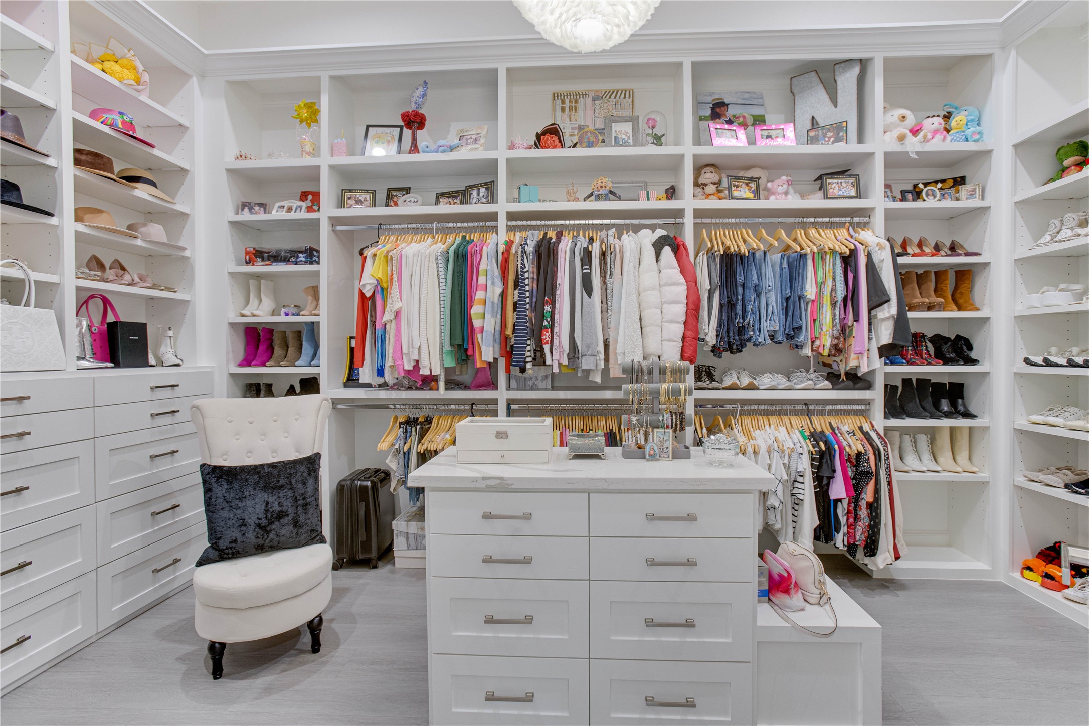 4821 1st Street Houston, TX 77504 - Photo 22 of 49 a view of walk in closet with clothes and shoes