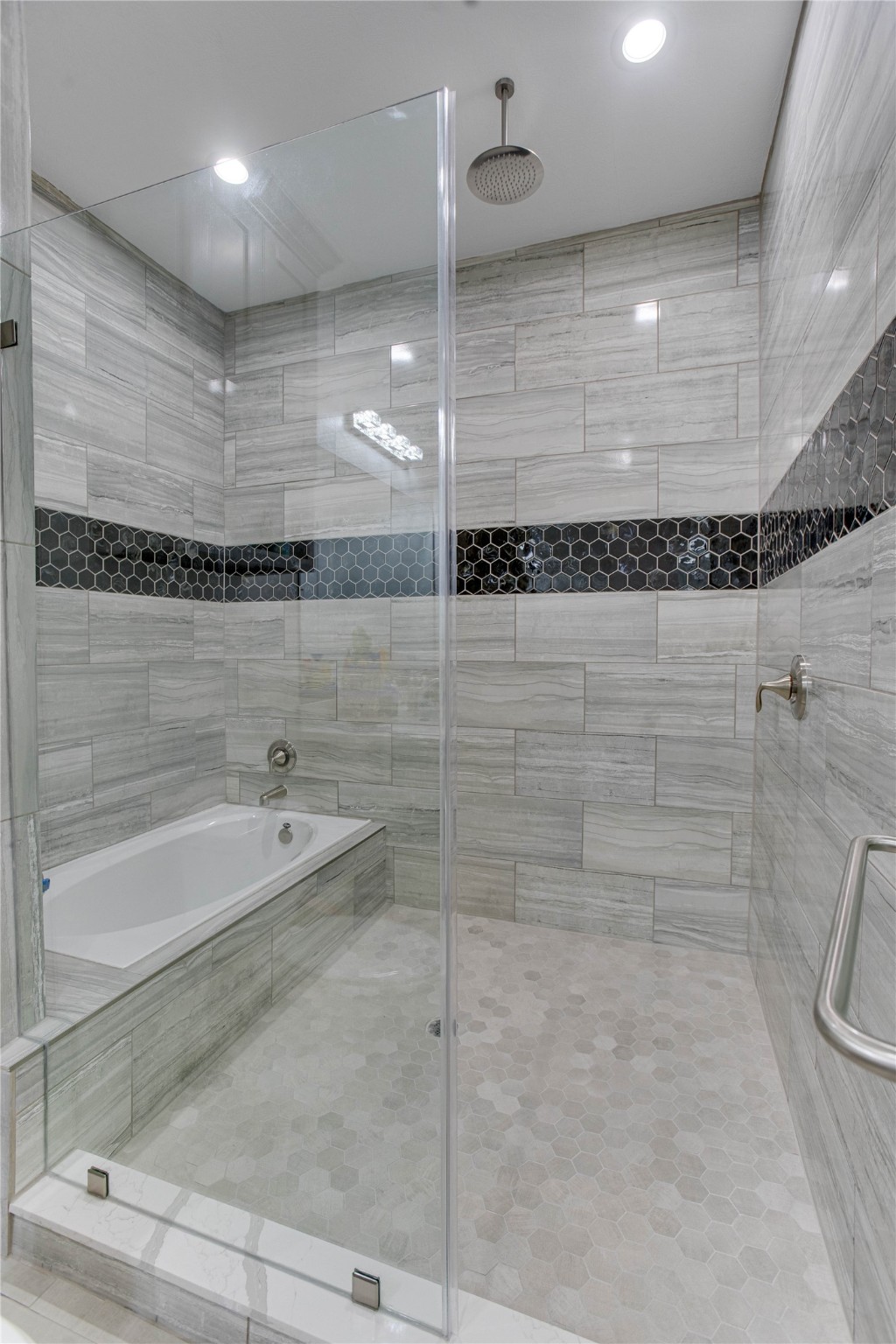 4821 1st Street Houston, TX 77504 - Photo 27 of 49 a bathroom with a shower and a tub