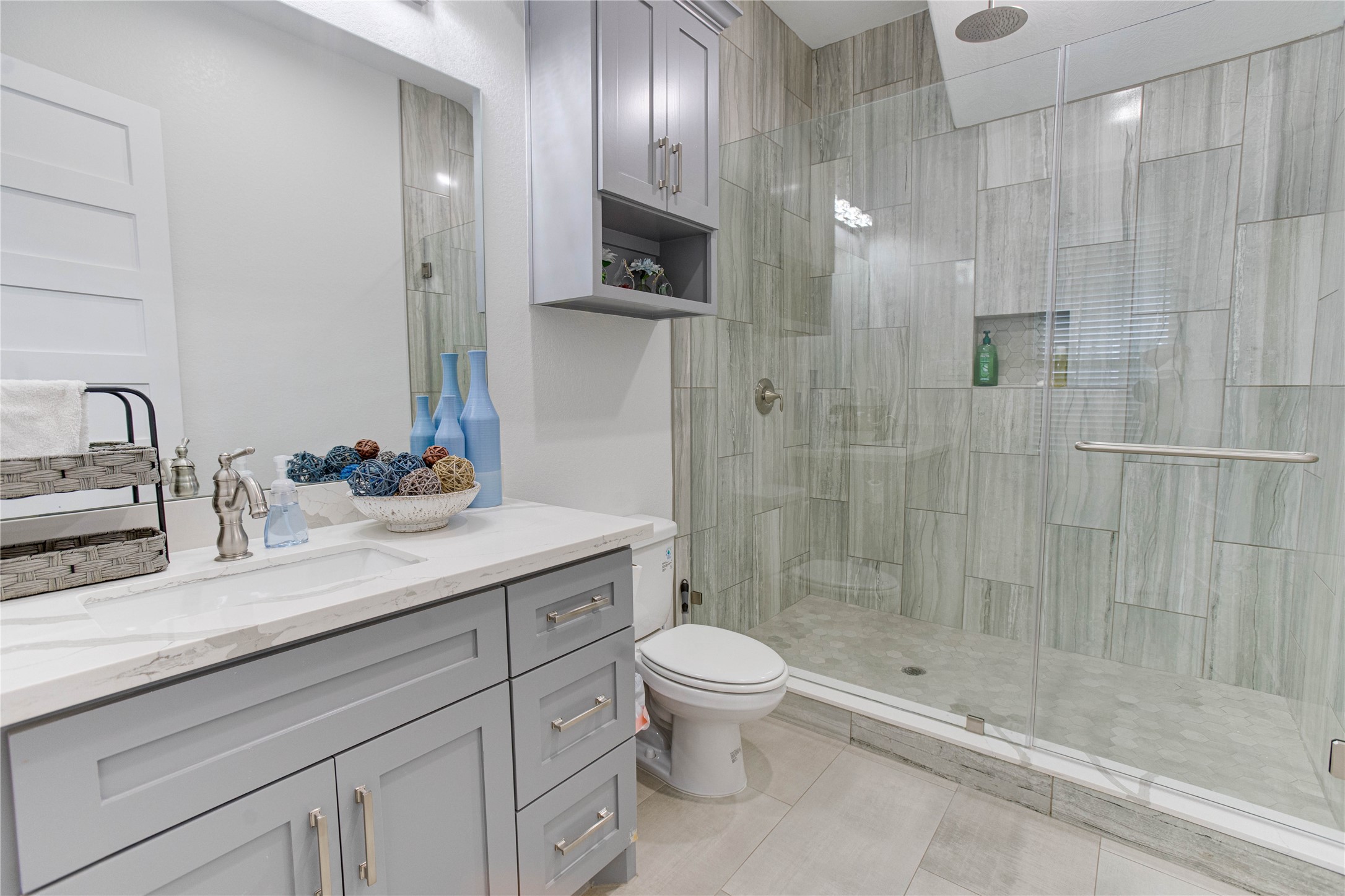 4821 1st Street Houston, TX 77504 - Photo 30 of 49 a bathroom with a sink a toilet and shower