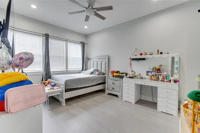 a bedroom with furniture and a window