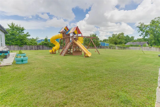 a view of a playground with basketball court