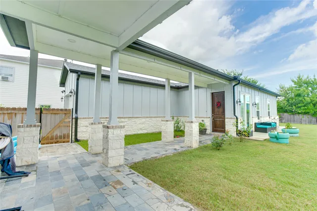 a kitchen with kitchen island stainless steel appliances a table and chairs in it