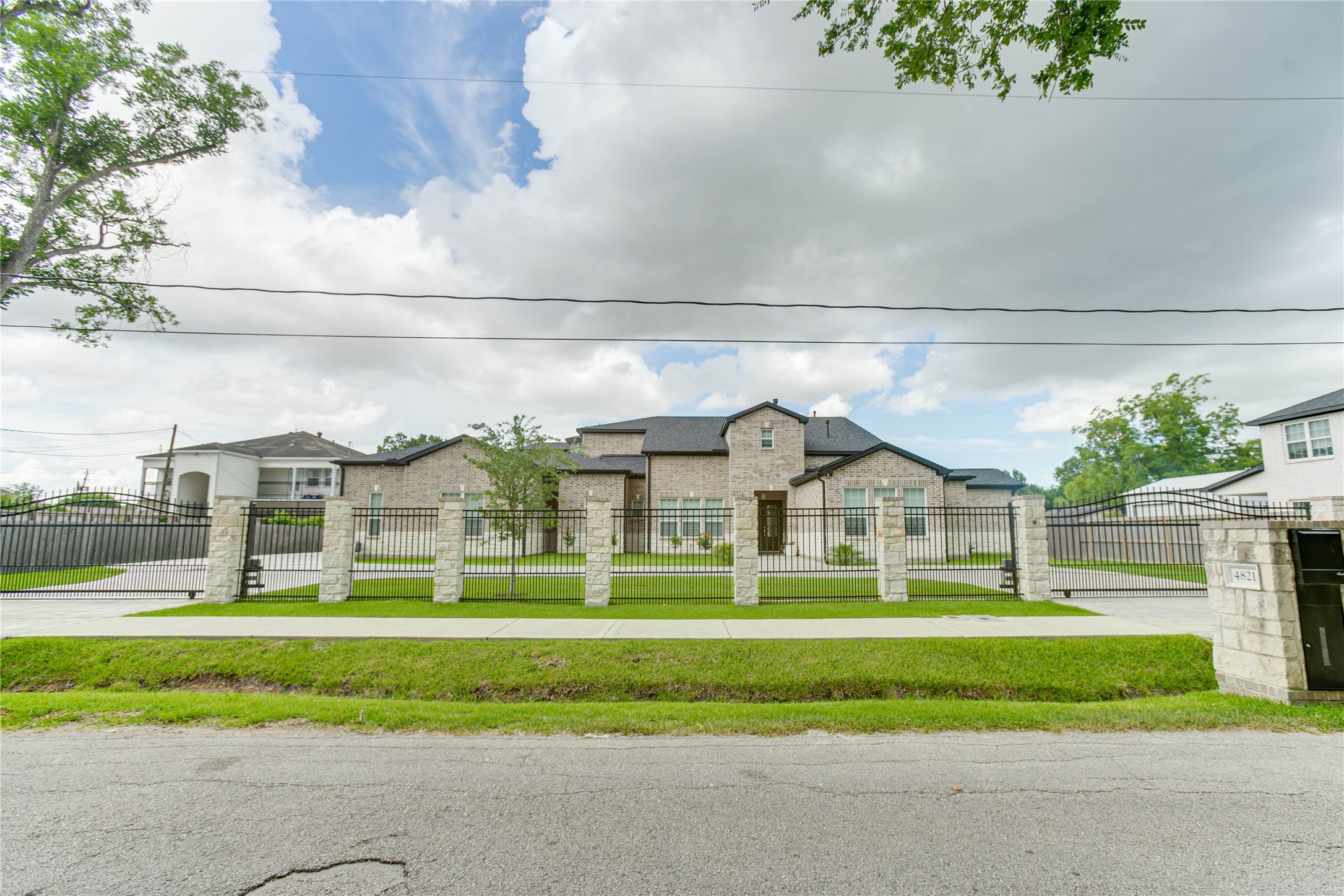 4821 1st Street Houston, TX 77504 - Photo 5 of 49 a front view of a house with a big yard and plants