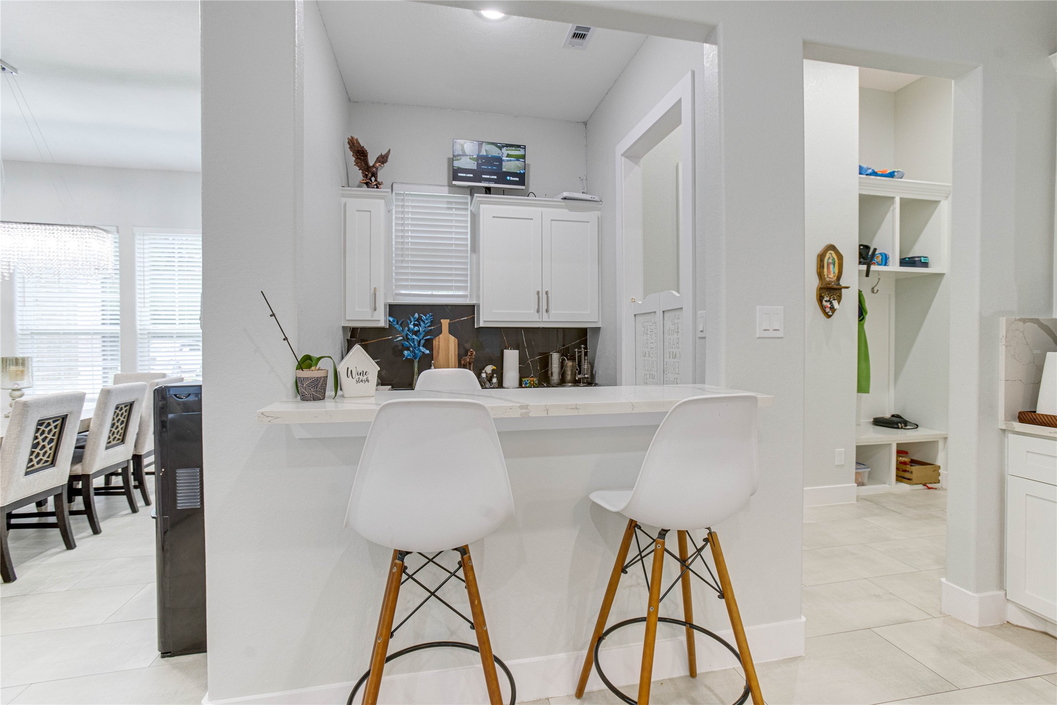 4821 1st Street Houston, TX 77504 - Photo 8 of 49 a living room with furniture a dining table and a chandelier