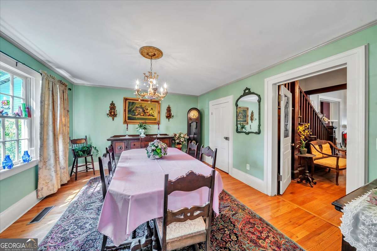 212 East Union Street Vienna, GA 31092 - Photo 18 of 62 a view of a dining room with furniture window and wooden floor