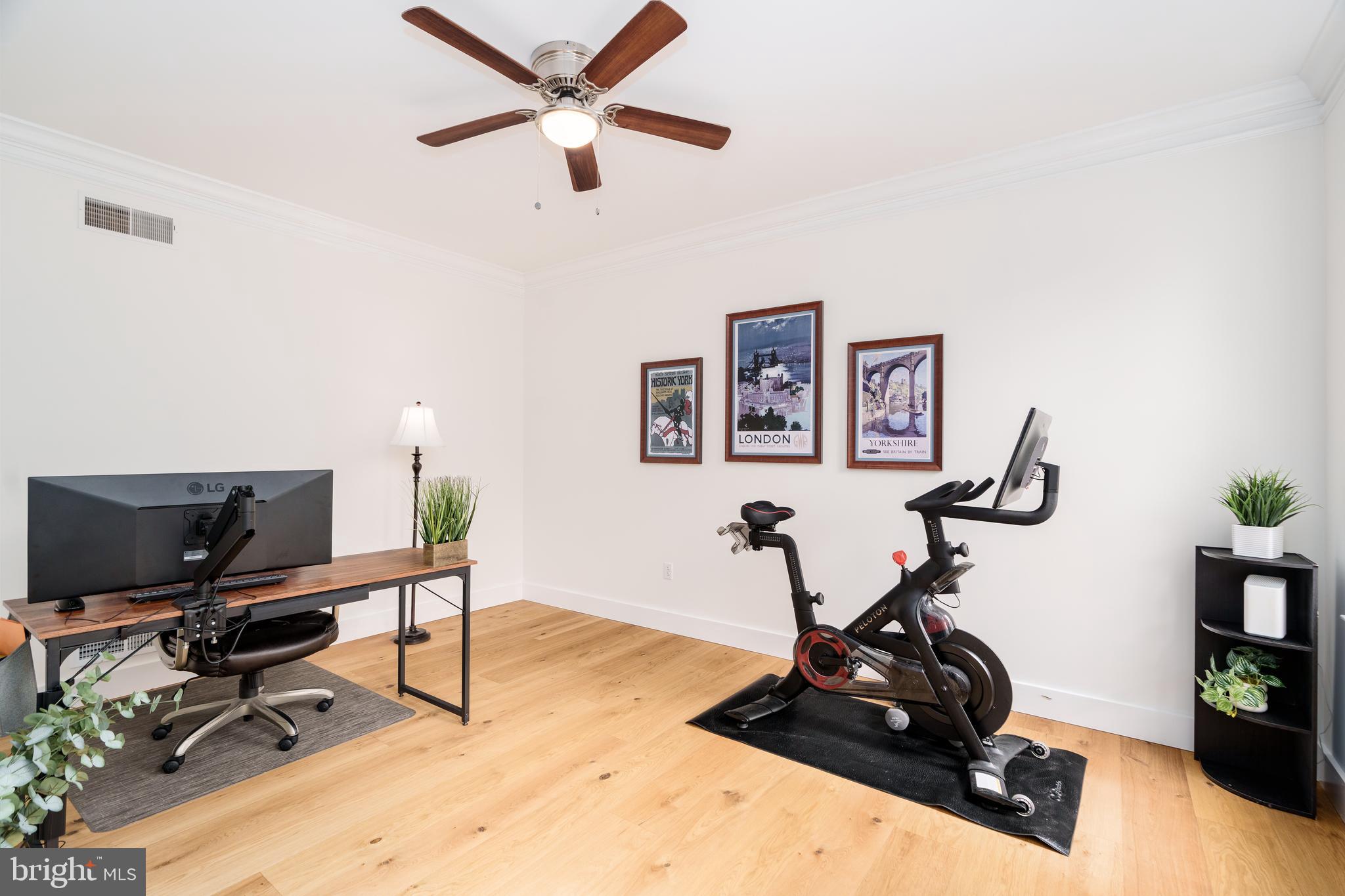 31 Wood Chip Road Elkton, MD 21921 - Photo 15 of 42 a view of a workspace with furniture and a gym