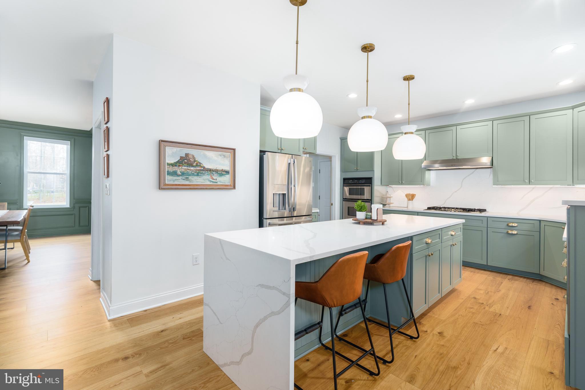 31 Wood Chip Road Elkton, MD 21921 - Photo 2 of 42 a kitchen with cabinets and chairs