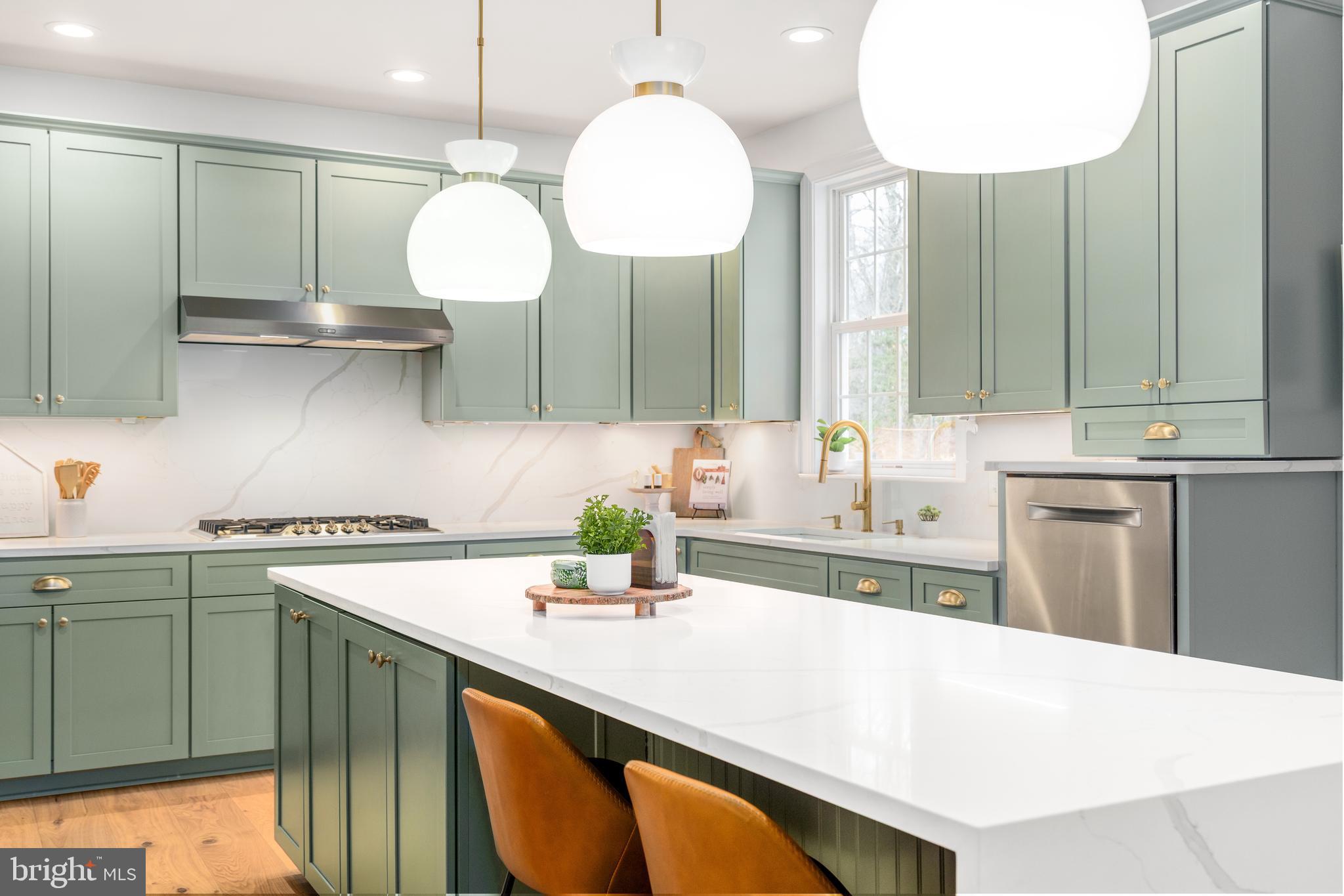 31 Wood Chip Road Elkton, MD 21921 - Photo 4 of 42 a kitchen with a sink a stove and cabinets