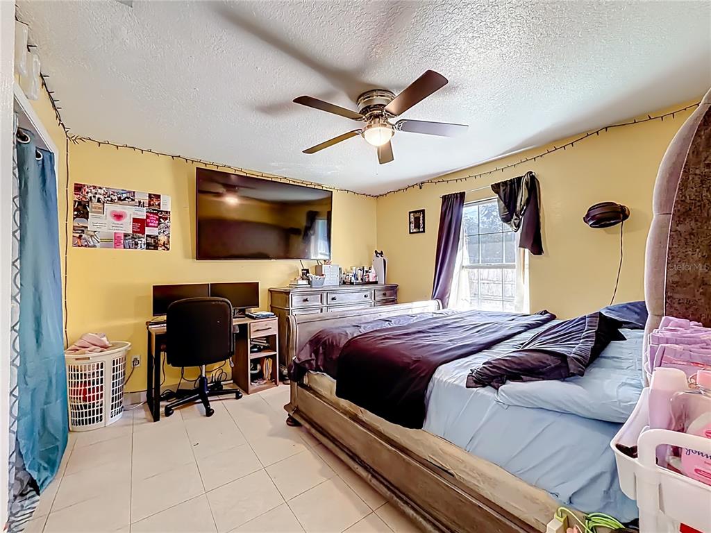 30 Hemlock Terrace Way Ocala, FL 34472 - Photo 13 of 44 a bedroom with a bed and furniture