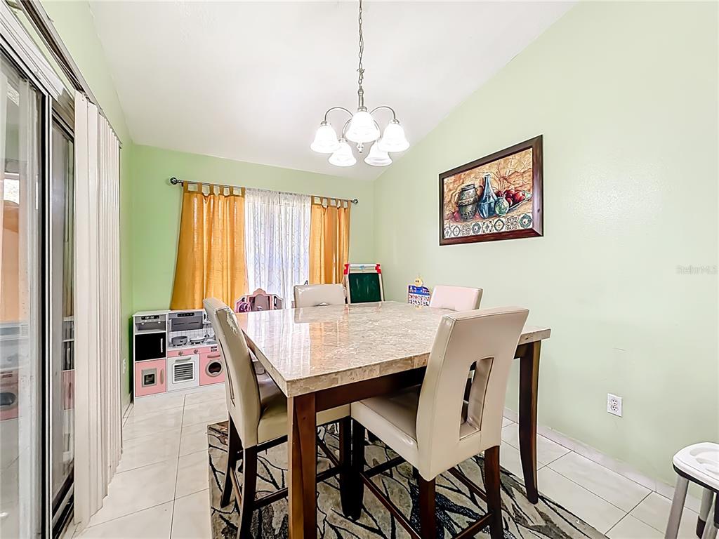 30 Hemlock Terrace Way Ocala, FL 34472 - Photo 16 of 44 a view of a dining room with furniture window and outside view