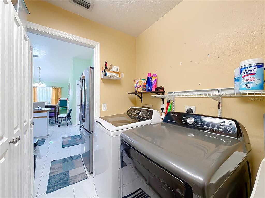 30 Hemlock Terrace Way Ocala, FL 34472 - Photo 22 of 44 a view of a dining table and chairs in a kitchen