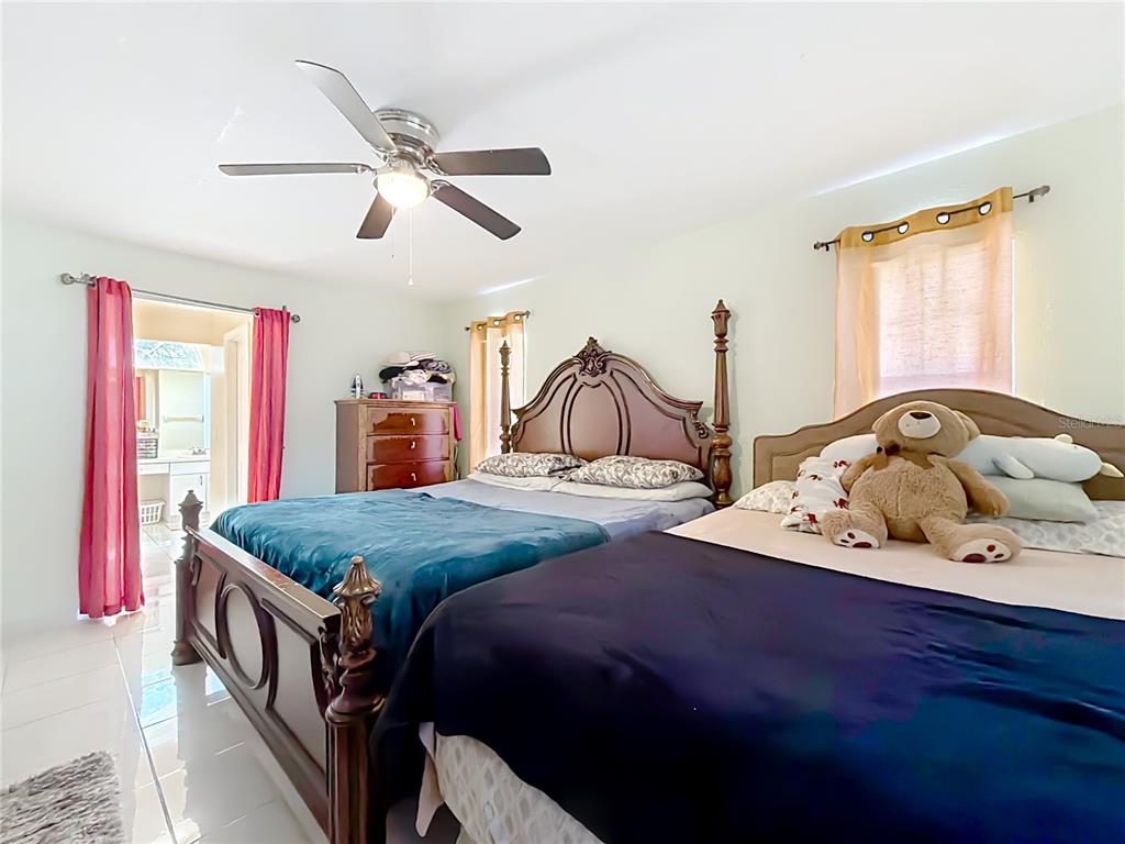 30 Hemlock Terrace Way Ocala, FL 34472 - Photo 23 of 44 a bedroom with two beds and window
