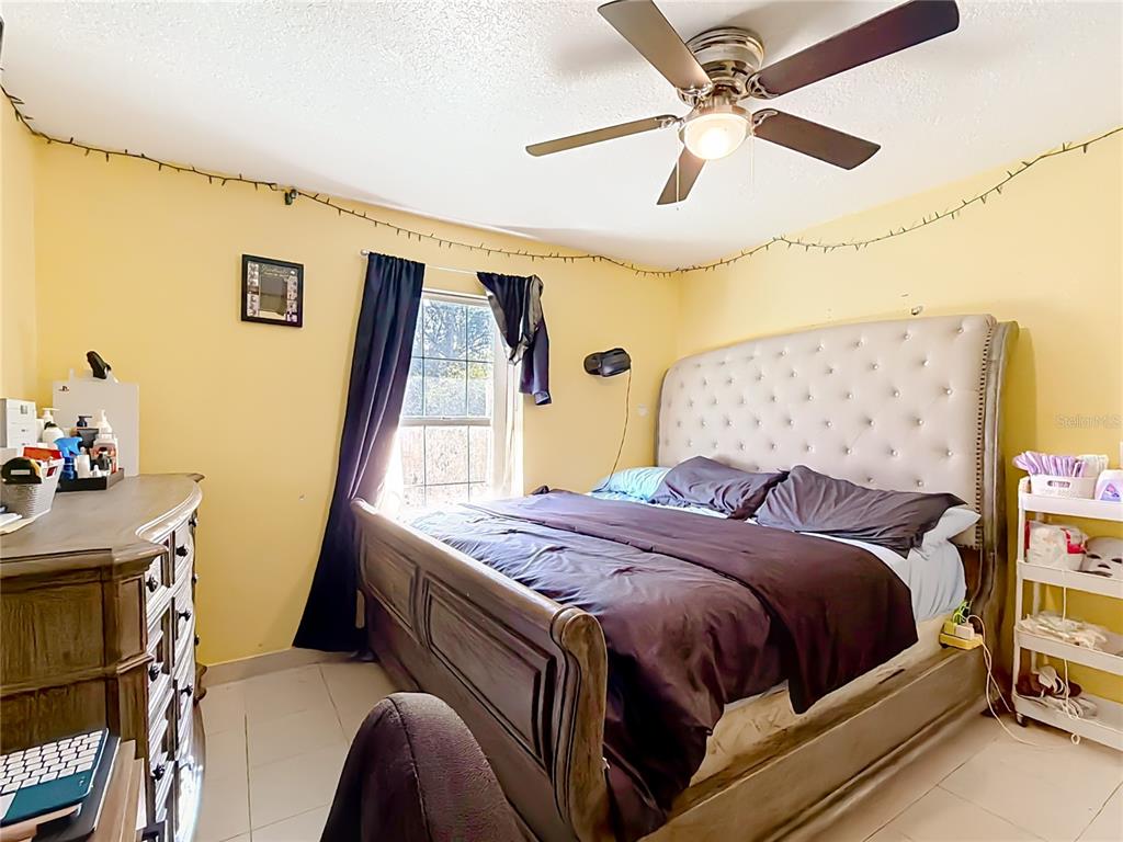 30 Hemlock Terrace Way Ocala, FL 34472 - Photo 28 of 44 a bedroom with a bed and a dresser