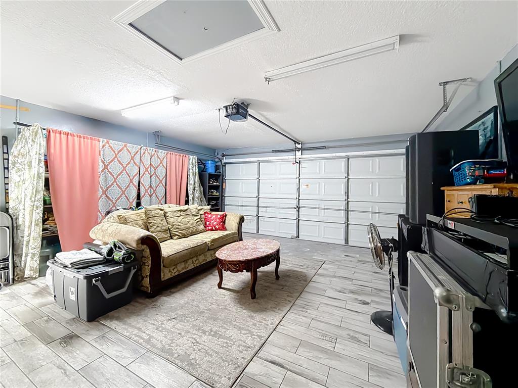 30 Hemlock Terrace Way Ocala, FL 34472 - Photo 30 of 44 a living room with furniture and a flat screen tv