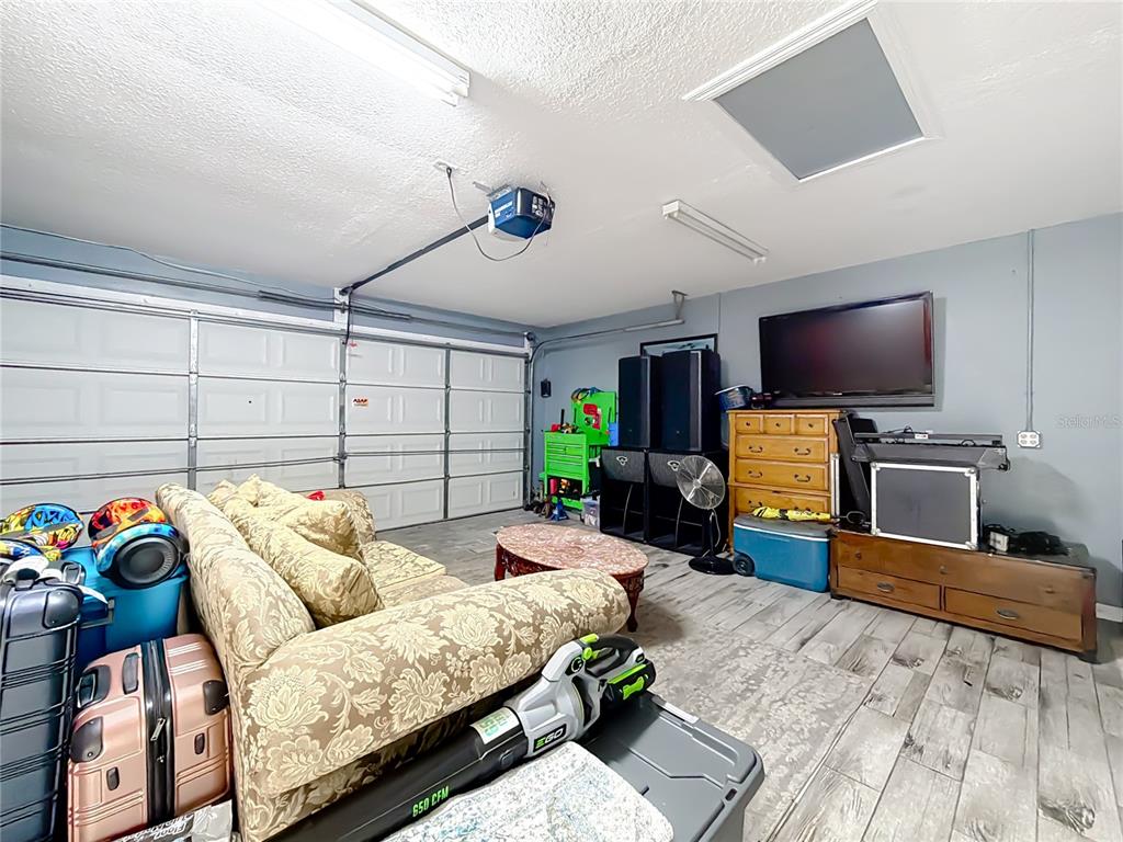 30 Hemlock Terrace Way Ocala, FL 34472 - Photo 31 of 44 a living room with furniture and a flat screen tv