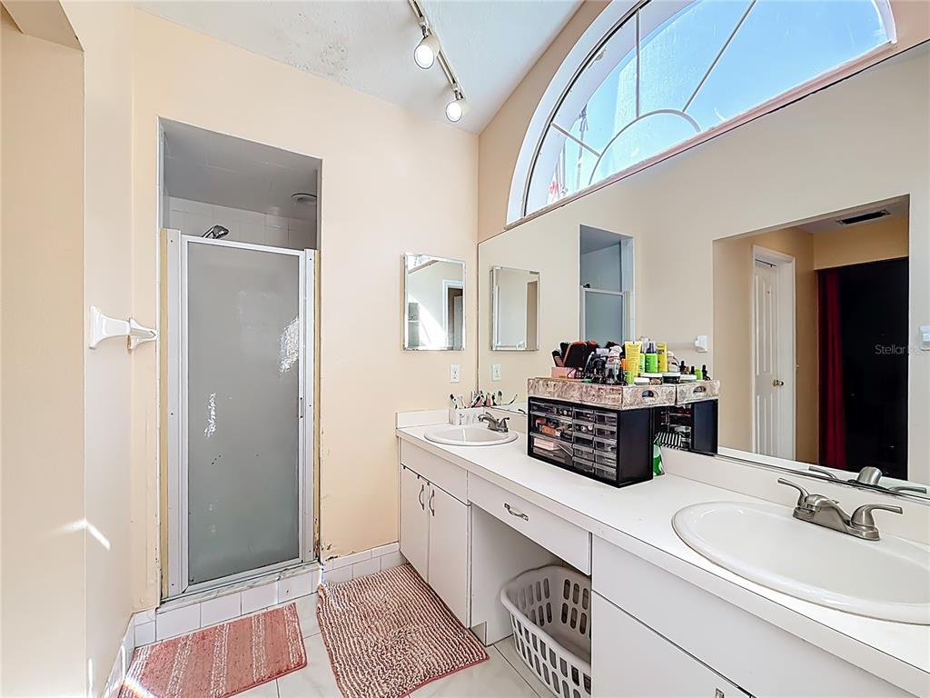 30 Hemlock Terrace Way Ocala, FL 34472 - Photo 34 of 44 a bathroom with a double vanity sink and a mirror