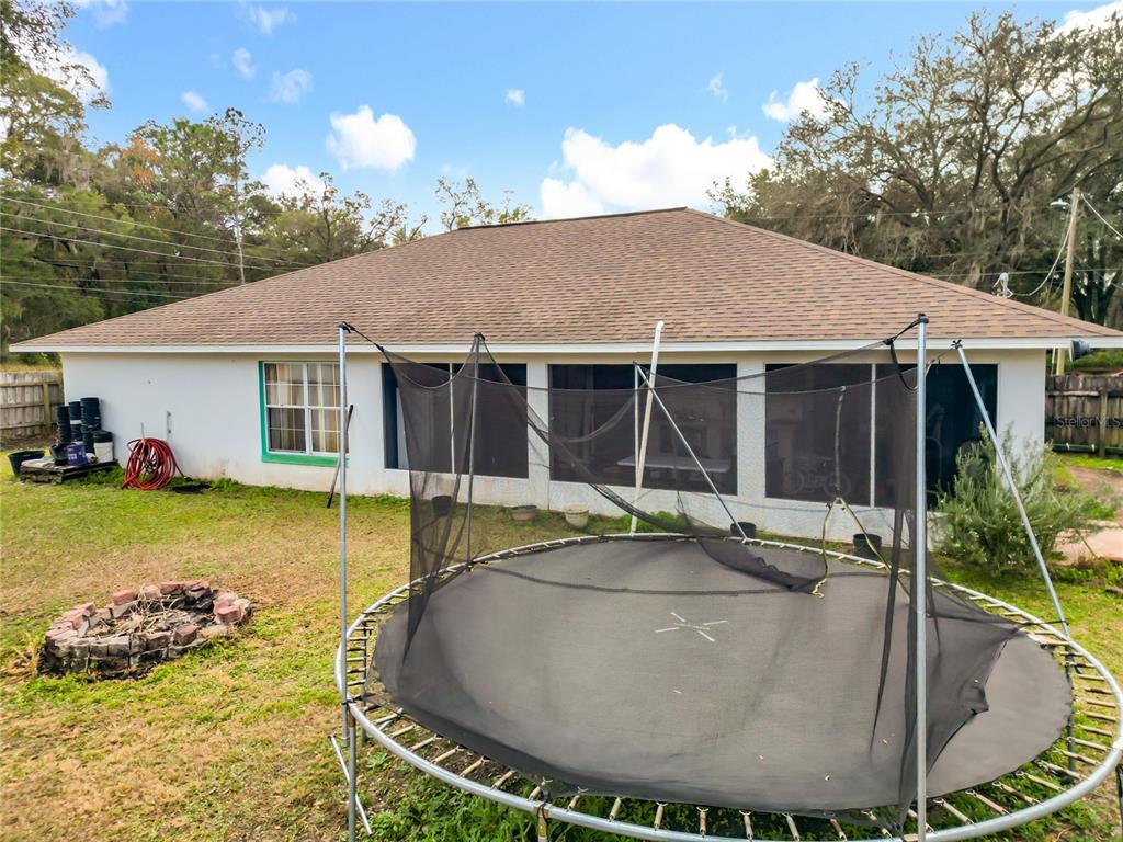 30 Hemlock Terrace Way Ocala, FL 34472 - Photo 36 of 44 a view of a house with swimming pool and sitting area