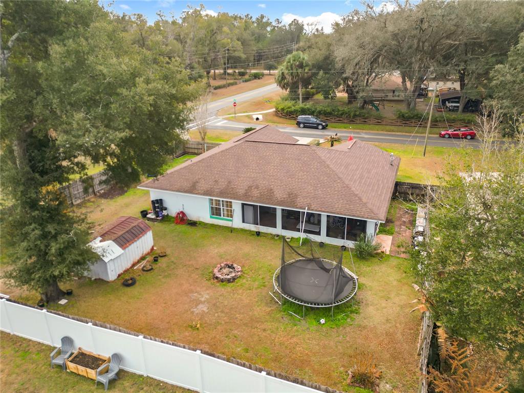 30 Hemlock Terrace Way Ocala, FL 34472 - Photo 37 of 44 an aerial view of a house with swimming pool and large trees