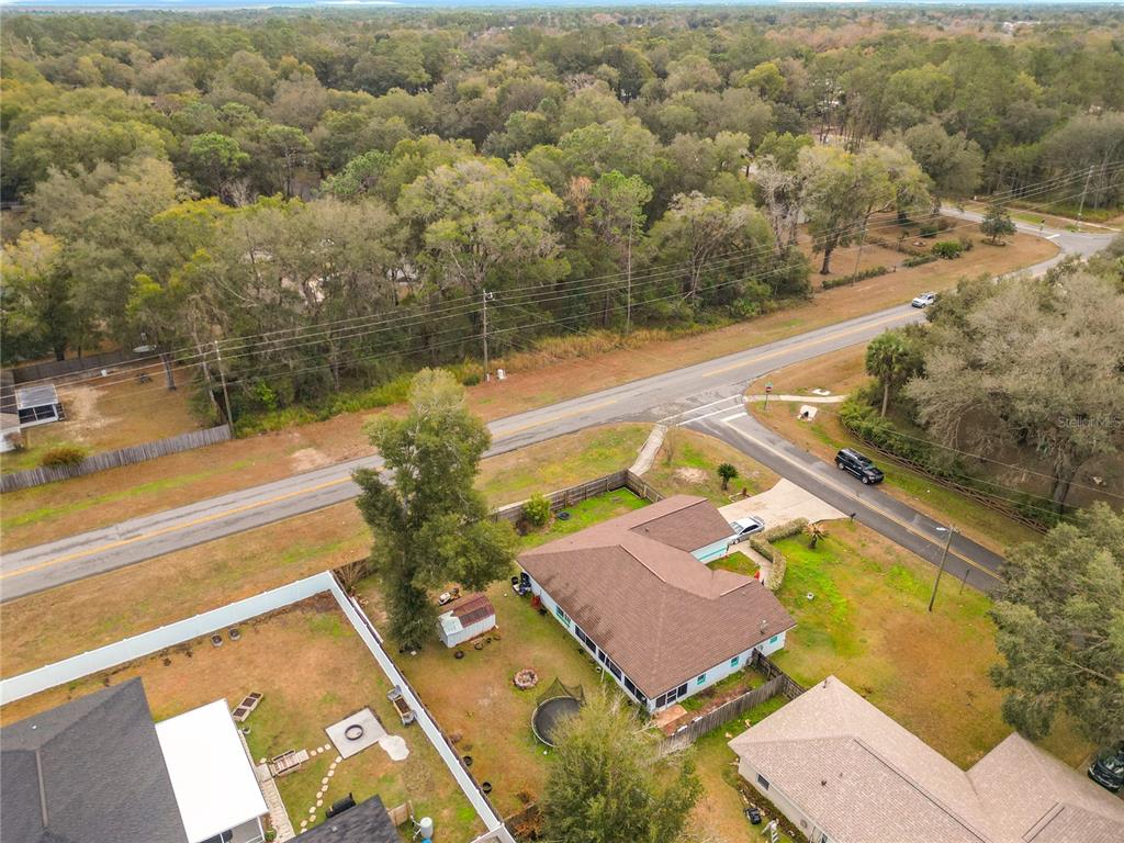 30 Hemlock Terrace Way Ocala, FL 34472 - Photo 43 of 44 a view of a swimming pool with a yard