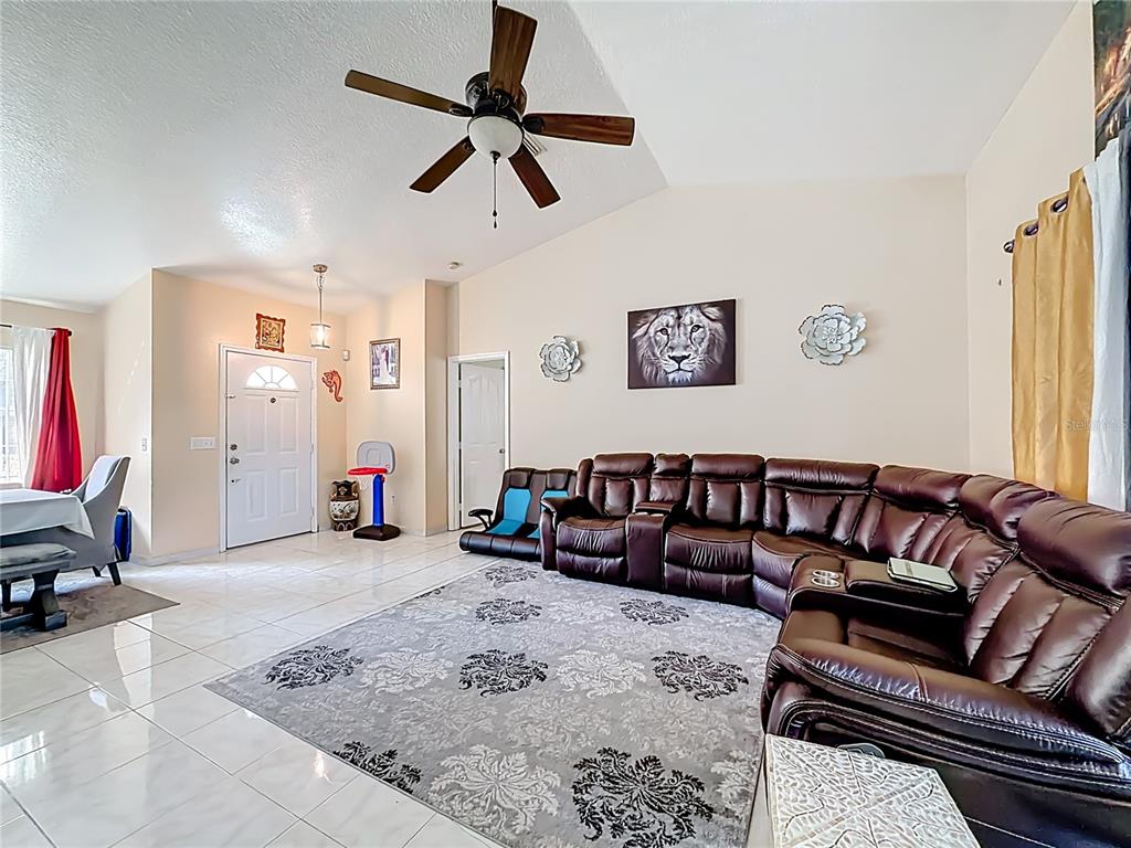 30 Hemlock Terrace Way Ocala, FL 34472 - Photo 6 of 44 a living room with furniture and a flat screen tv