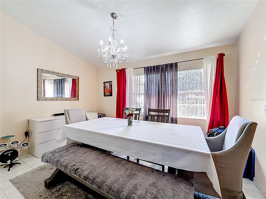30 Hemlock Terrace Way Ocala, FL 34472 - Photo 7 of 44 a living room with furniture and a chandelier