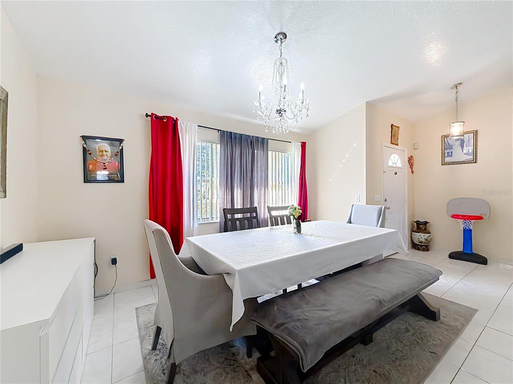 30 Hemlock Terrace Way Ocala, FL 34472 - Photo 8 of 44 a living room with furniture and a chandelier