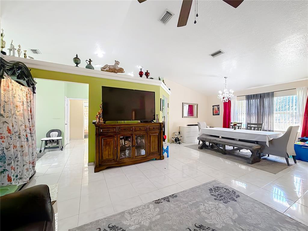 30 Hemlock Terrace Way Ocala, FL 34472 - Photo 9 of 44 a living room with furniture and a flat screen tv