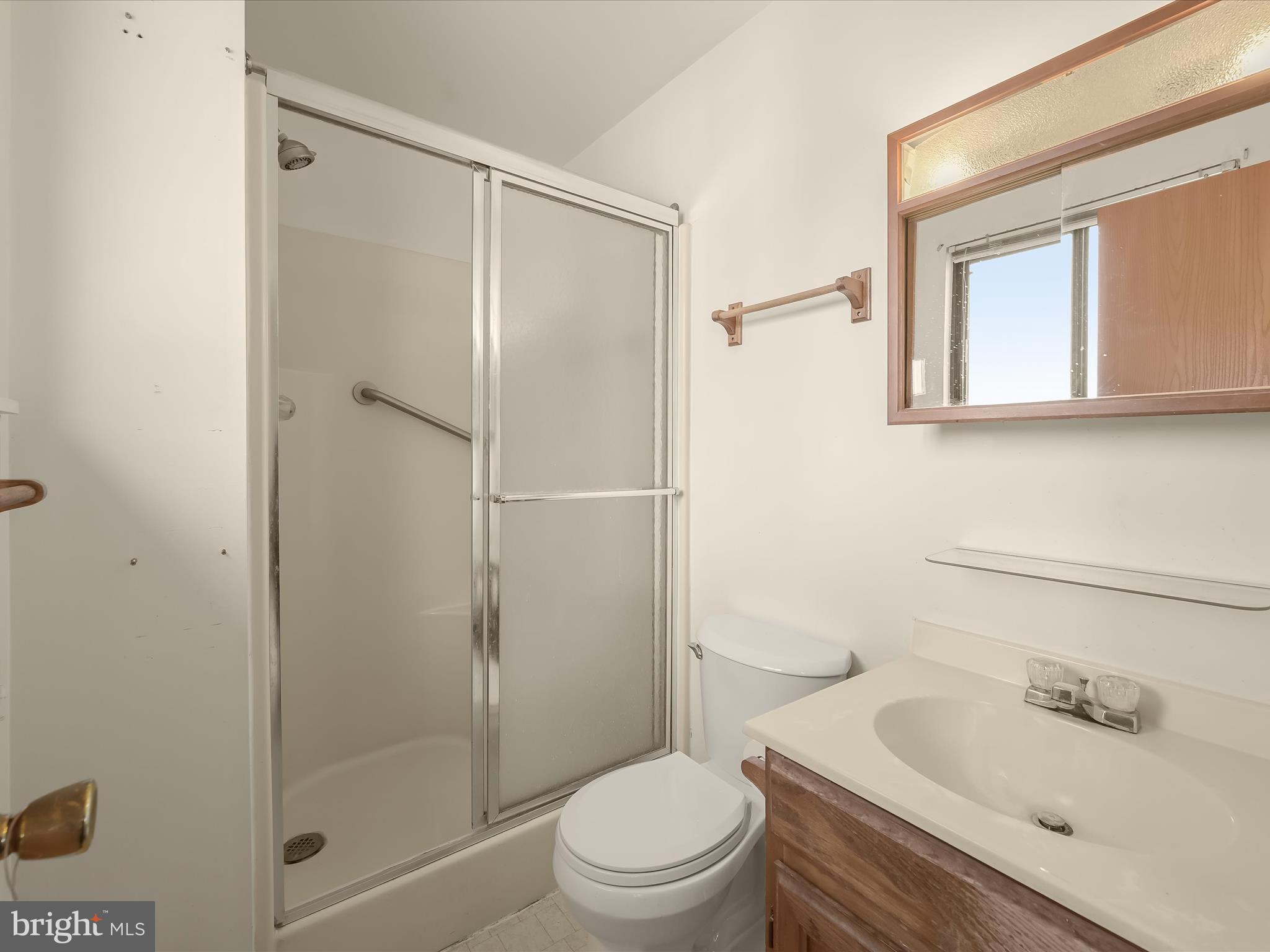 1100 Cedarbrook Road Hampstead, MD 21074 - Photo 21 of 46 a bathroom with a sink toilet and shower