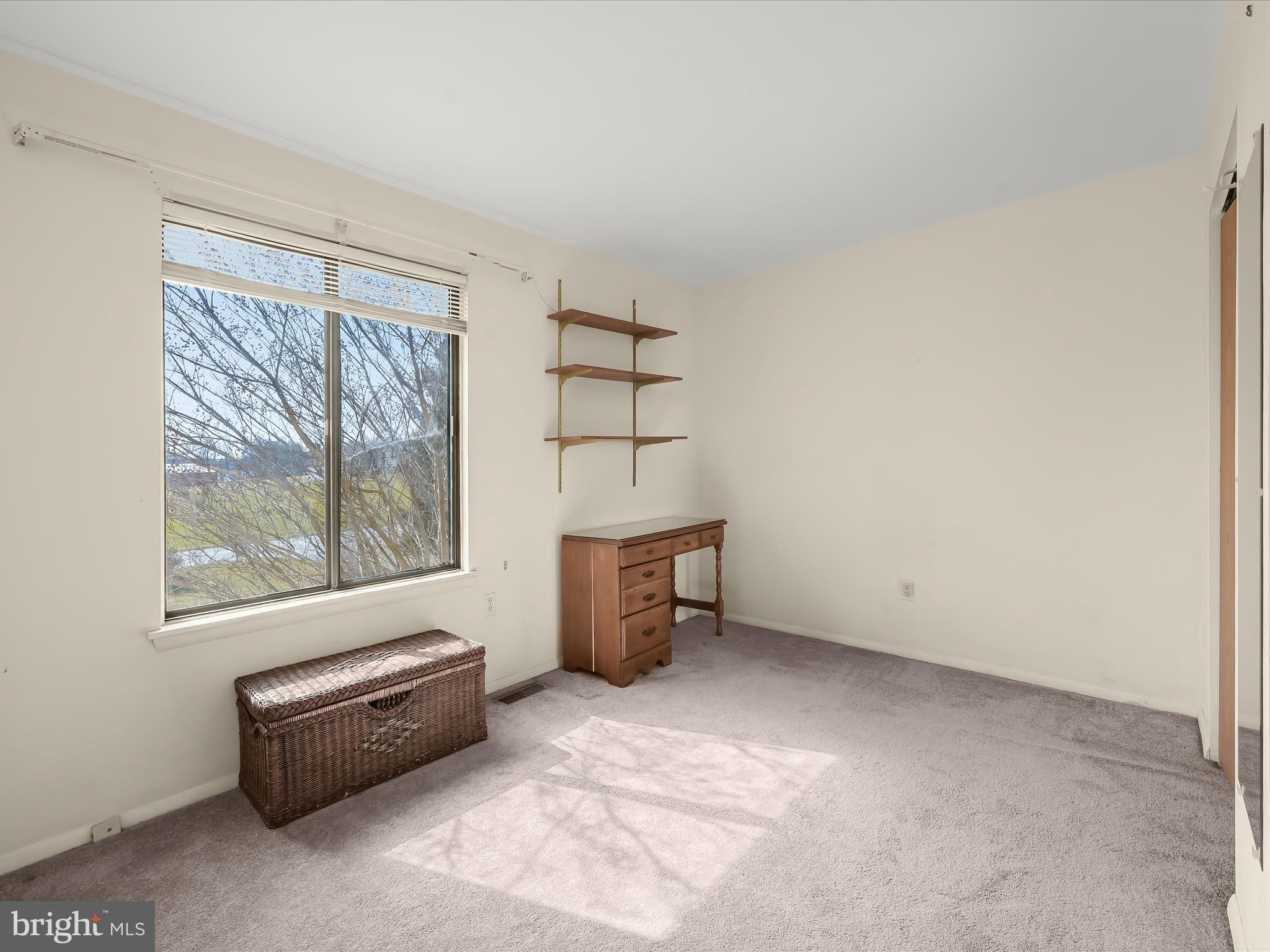 1100 Cedarbrook Road Hampstead, MD 21074 - Photo 23 of 46 an empty room with furniture and window