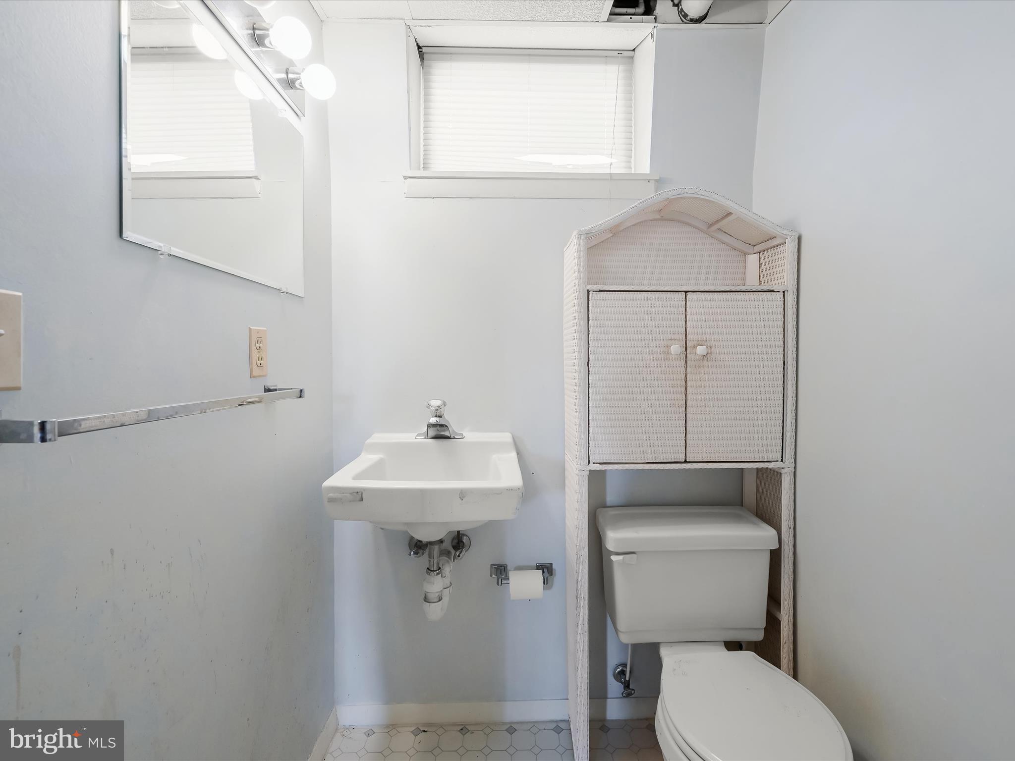 1100 Cedarbrook Road Hampstead, MD 21074 - Photo 32 of 46 a bathroom with a toilet sink and mirror
