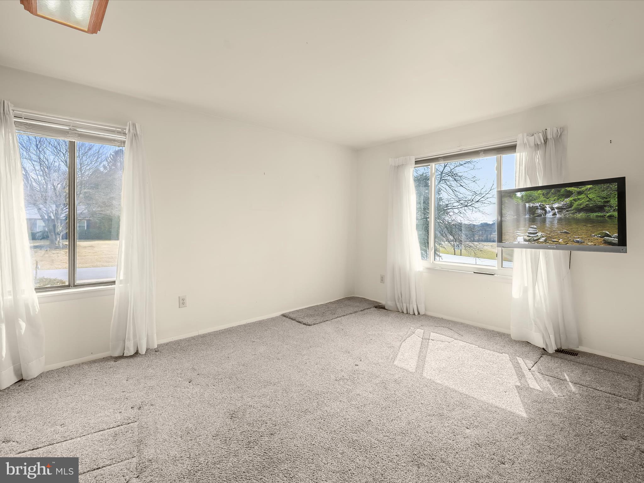 1100 Cedarbrook Road Hampstead, MD 21074 - Photo 5 of 46 an empty room with windows