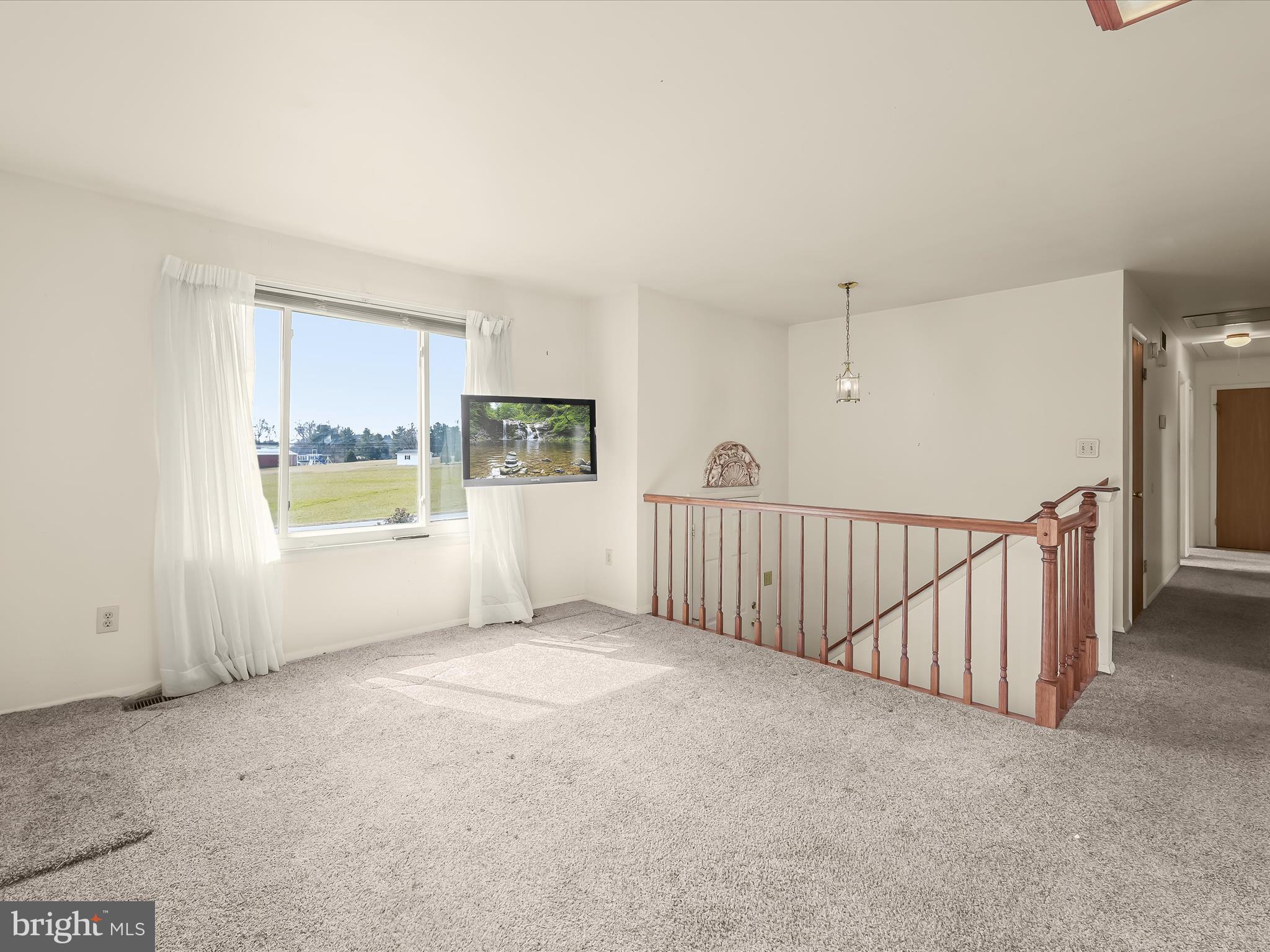 1100 Cedarbrook Road Hampstead, MD 21074 - Photo 6 of 46 a view of an empty room with a window