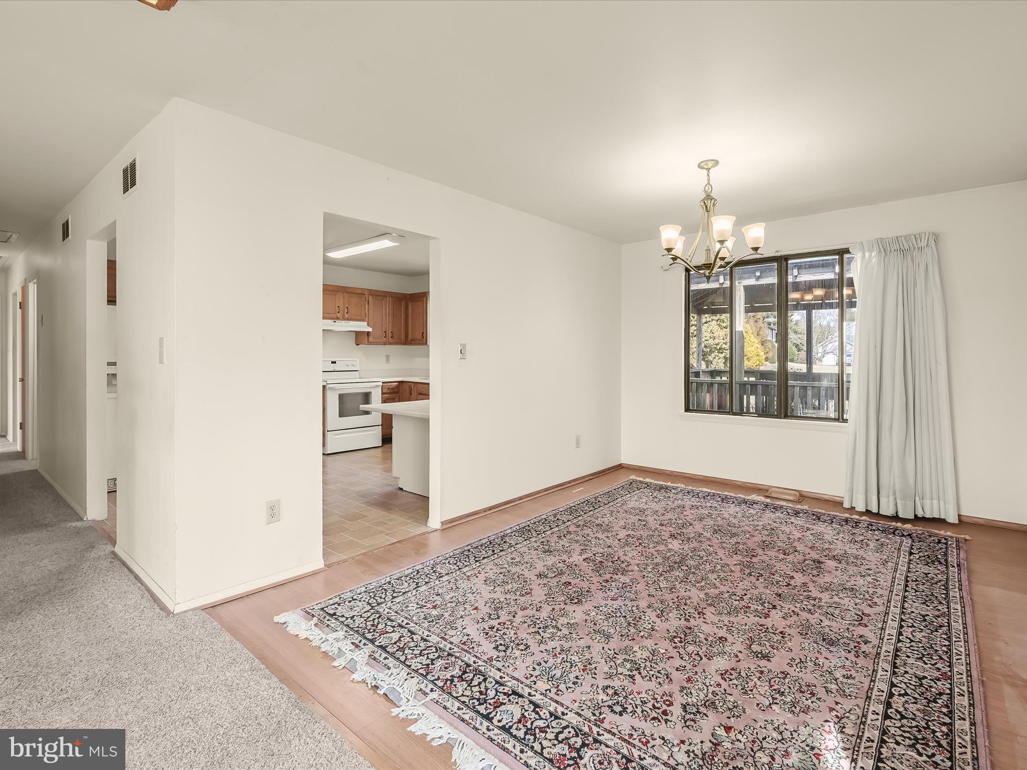 1100 Cedarbrook Road Hampstead, MD 21074 - Photo 10 of 46 an empty room with window and wooden floor