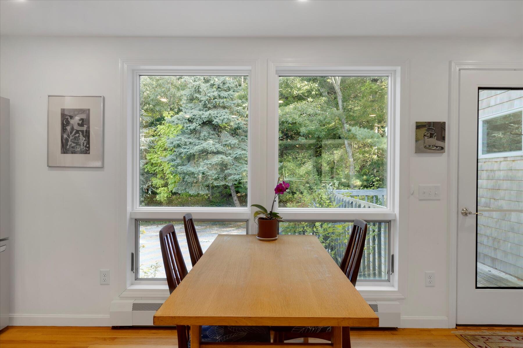 225 Coles Neck Road Wellfleet, MA 02667 - Photo 13 of 51 a view of a dining room with furniture window and wooden floor