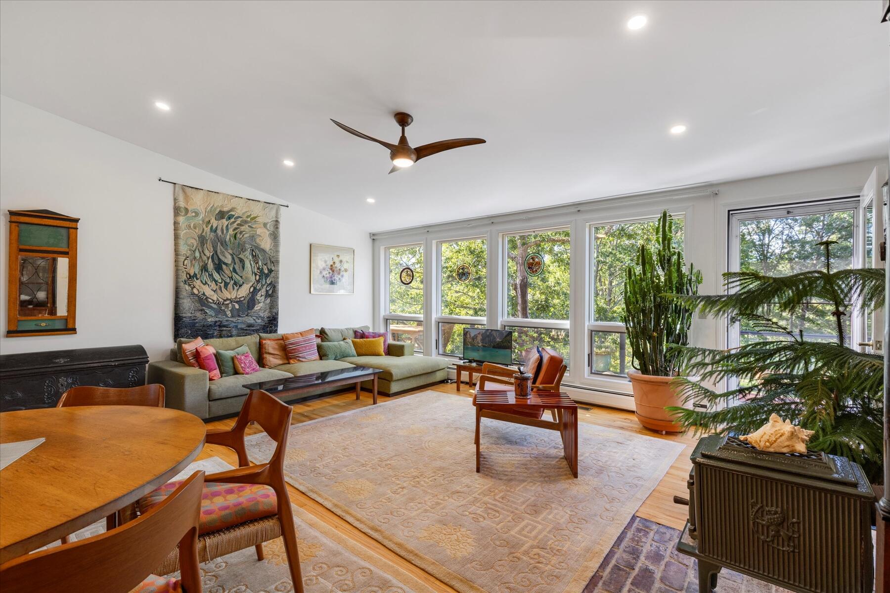 225 Coles Neck Road Wellfleet, MA 02667 - Photo 16 of 51 a living room with furniture and a large window
