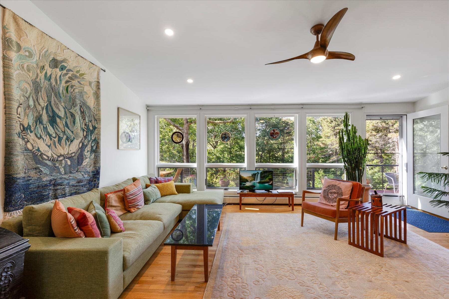 225 Coles Neck Road Wellfleet, MA 02667 - Photo 17 of 51 a living room with furniture and a large window