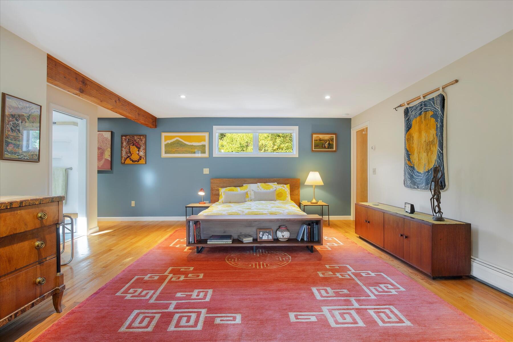 225 Coles Neck Road Wellfleet, MA 02667 - Photo 20 of 51 a spacious bedroom with a bed and a dresser in it