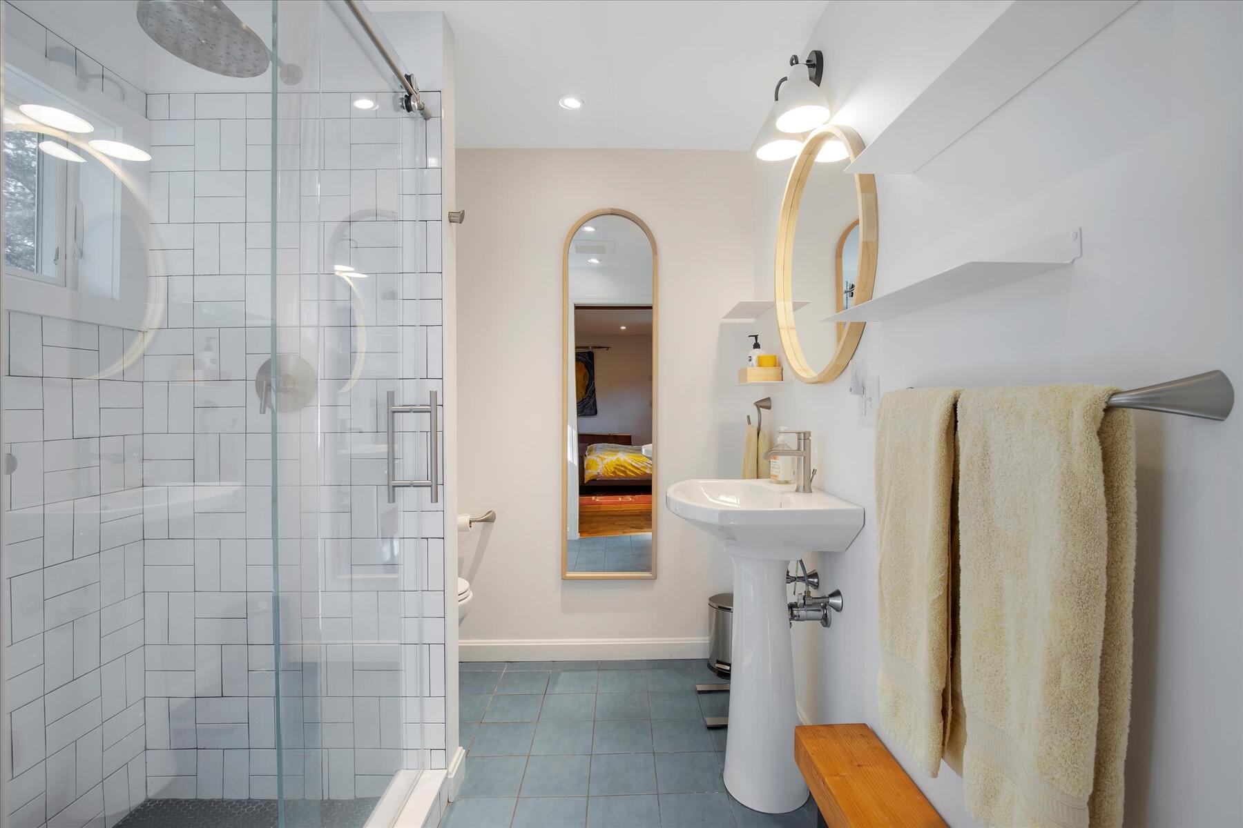 225 Coles Neck Road Wellfleet, MA 02667 - Photo 25 of 51 a bathroom with a sink a toilet and shower