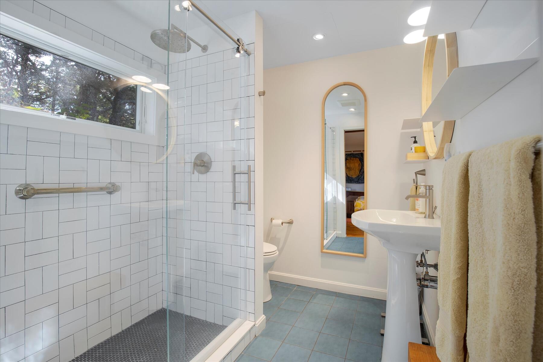 225 Coles Neck Road Wellfleet, MA 02667 - Photo 26 of 51 a bathroom with a bathtub shower sink mirror and toilet