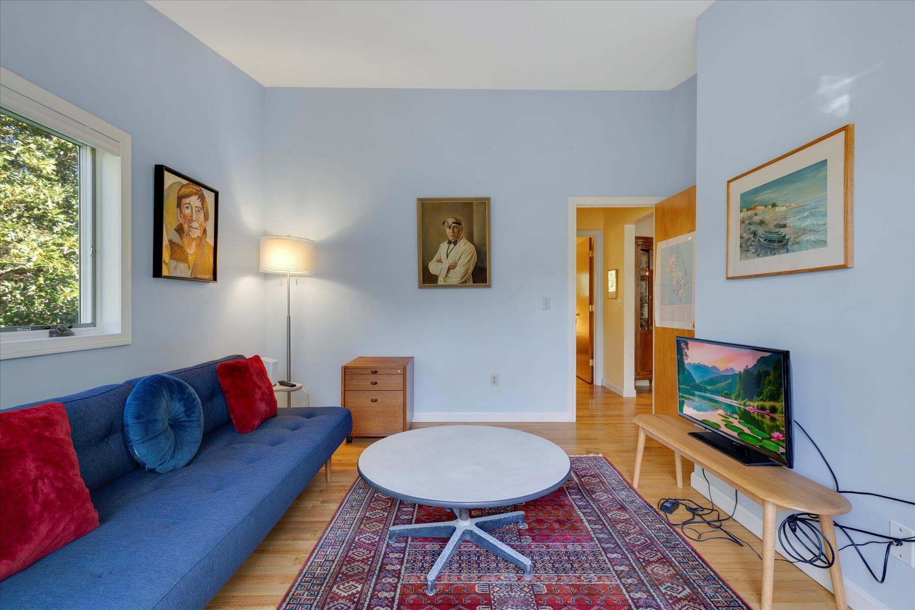 225 Coles Neck Road Wellfleet, MA 02667 - Photo 34 of 51 a living room with furniture a flat screen tv and a window