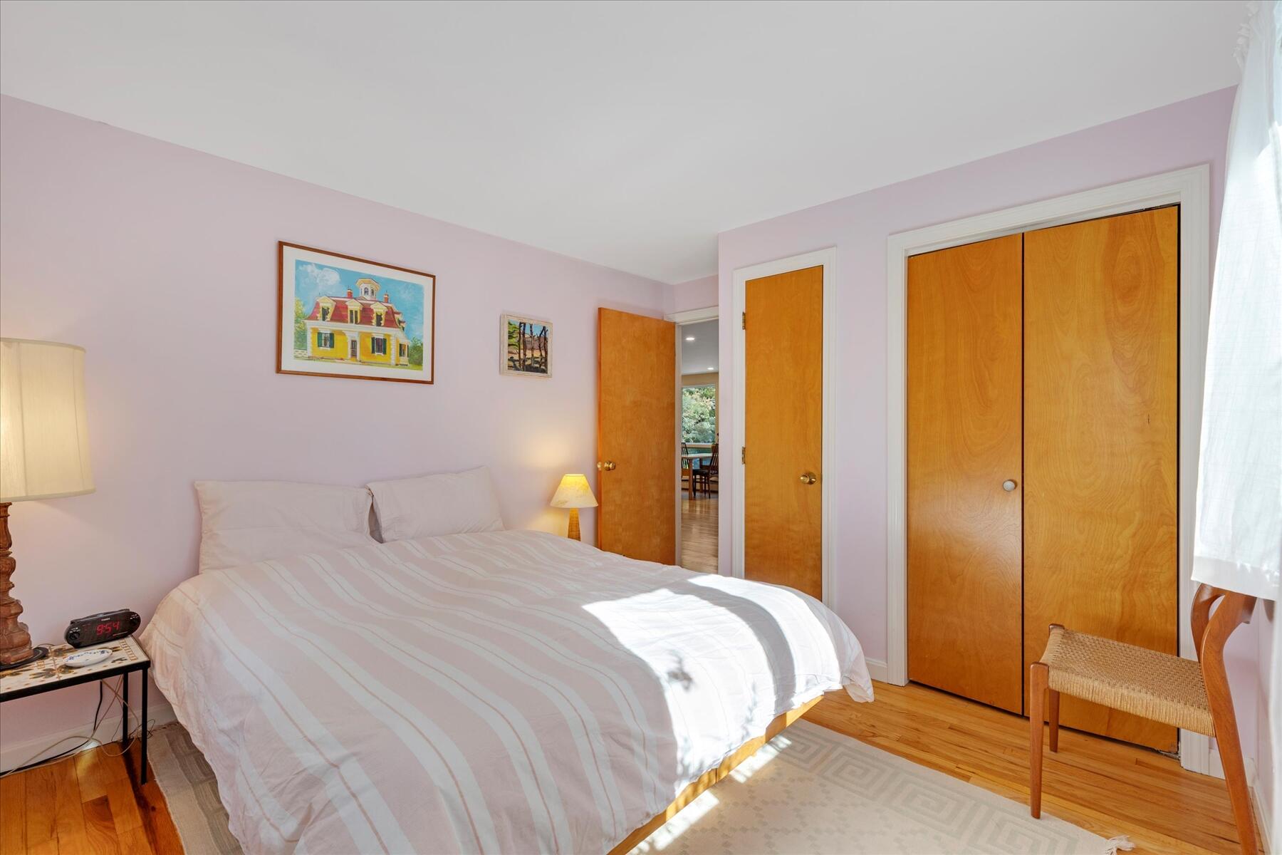 225 Coles Neck Road Wellfleet, MA 02667 - Photo 36 of 51 a bedroom with a bed and a view of bathroom