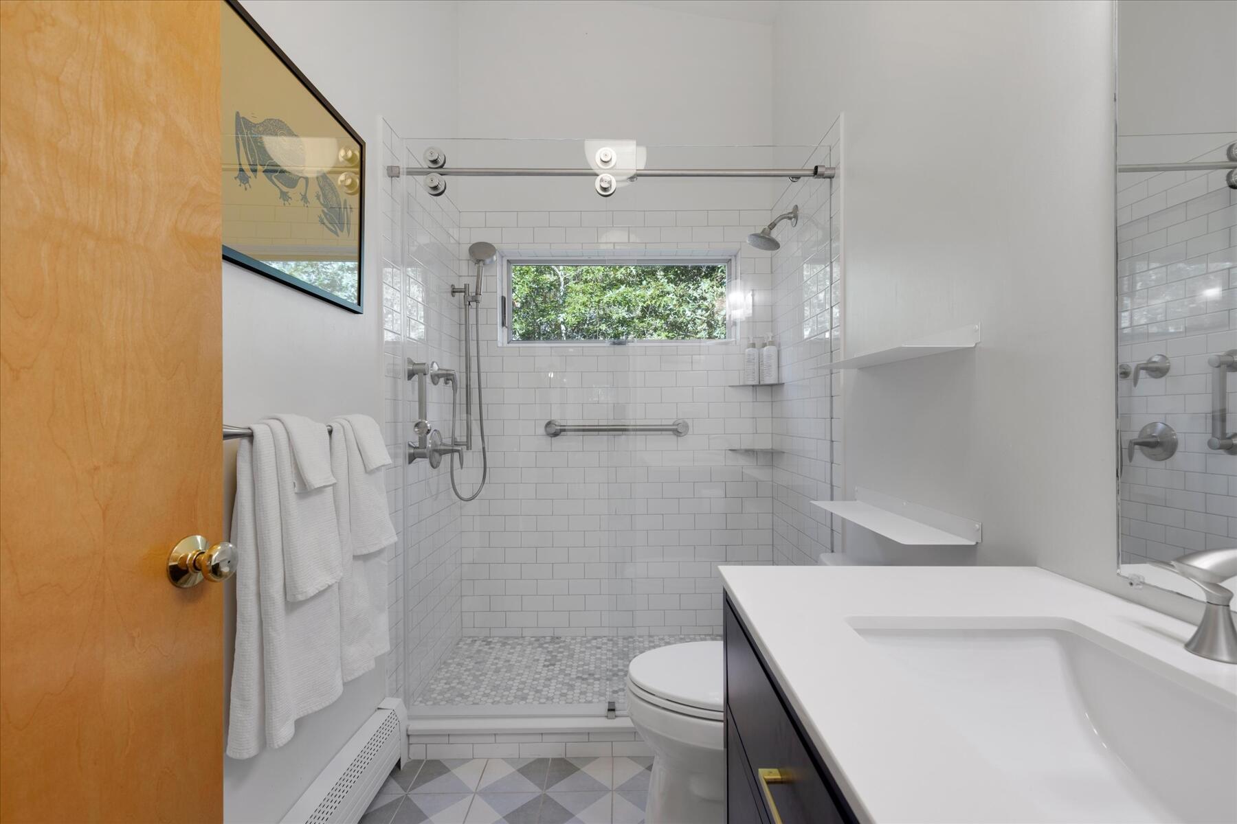 225 Coles Neck Road Wellfleet, MA 02667 - Photo 38 of 51 a bathroom with a sink a toilet and shower