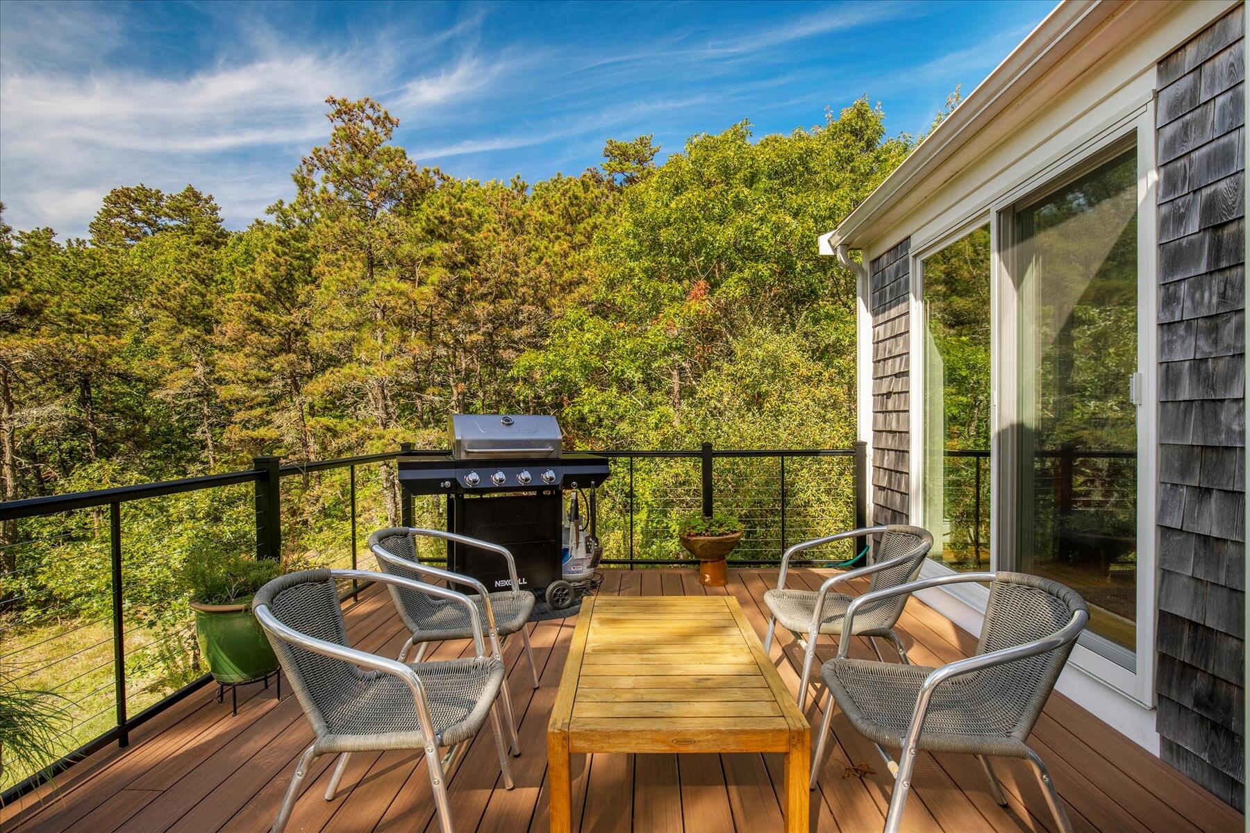 225 Coles Neck Road Wellfleet, MA 02667 - Photo 41 of 51 a view of a balcony with chairs