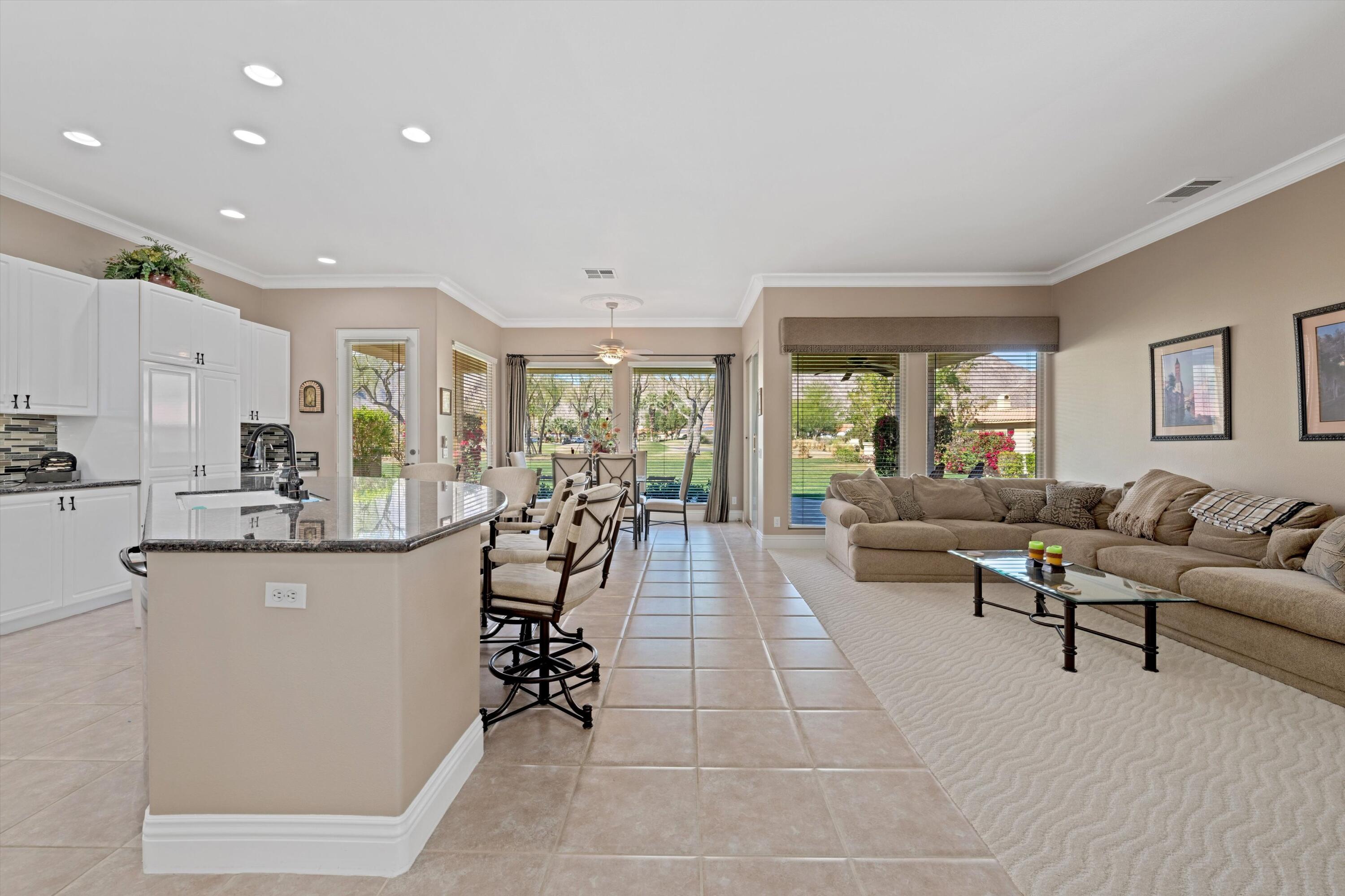 57255 Interlachen La Quinta, CA 92253 - Photo 15 of 34 a living room with furniture and a large window