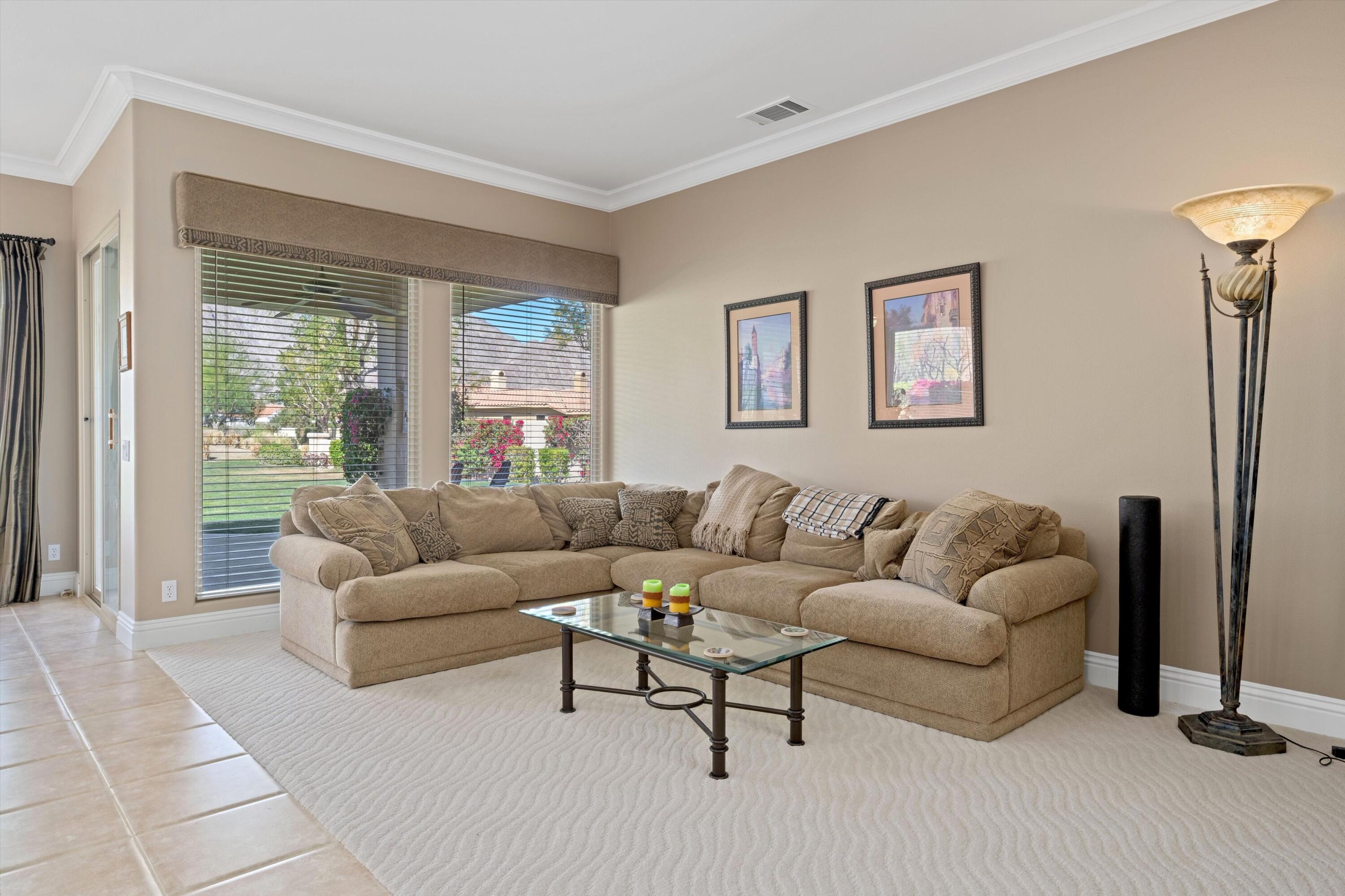 57255 Interlachen La Quinta, CA 92253 - Photo 16 of 34 a living room with furniture and a large window