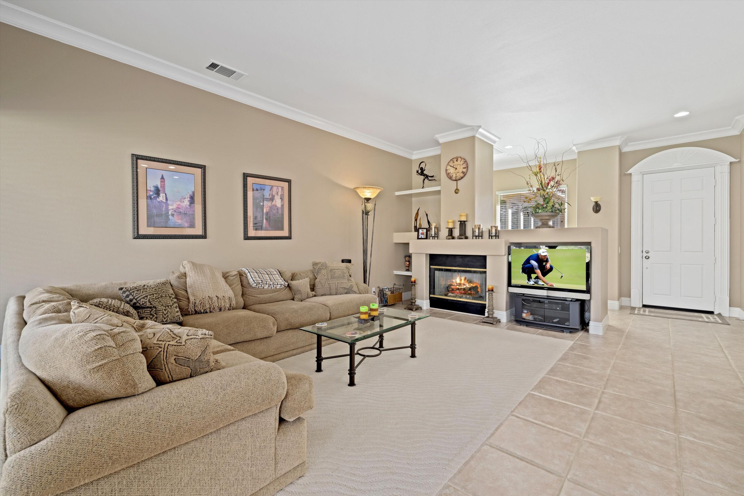 57255 Interlachen La Quinta, CA 92253 - Photo 17 of 34 a living room with furniture and a flat screen tv
